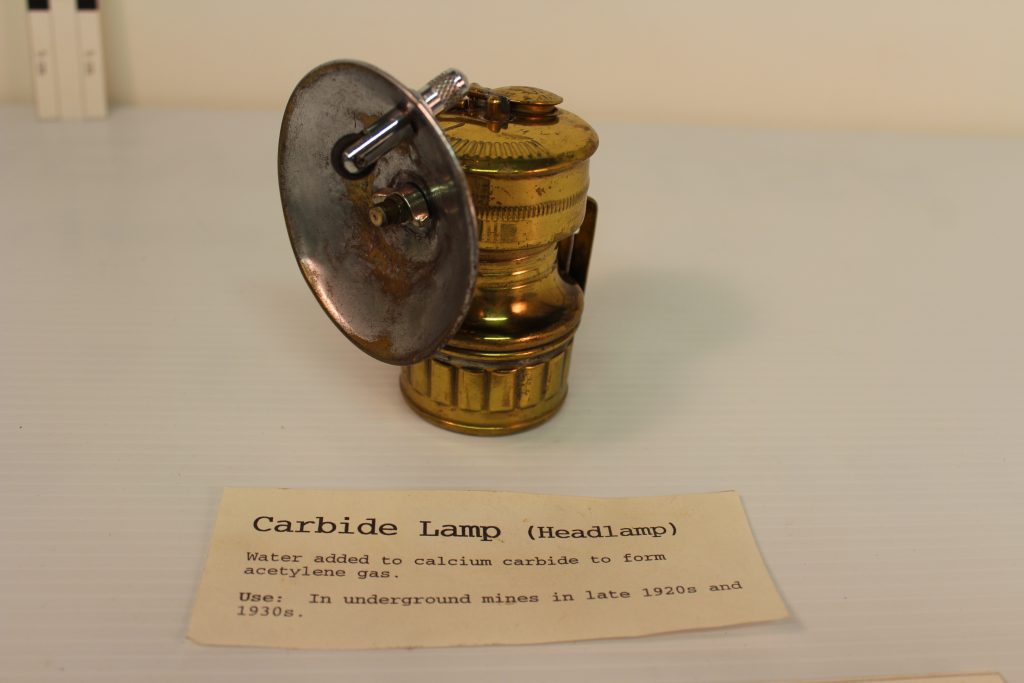 Historic carbide mining lamp. This lamp would have connected to a miners helmet and had a small flame that produced light. BLM Collection.